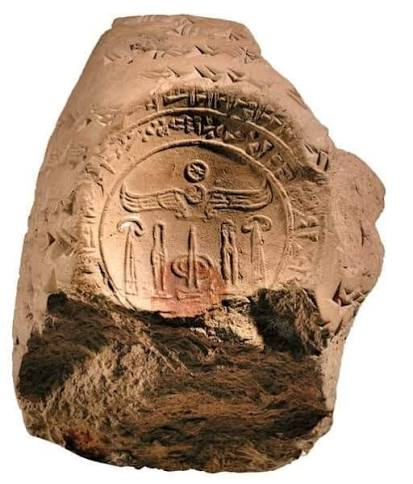 Clay sealing with an impressed seal and cuneiform signs